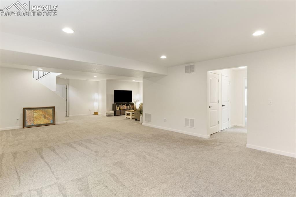 11969 Alydar Loop Colorado Springs, CO 80921 - Photo 29 of 44 a view of a livingroom with a flat screen tv