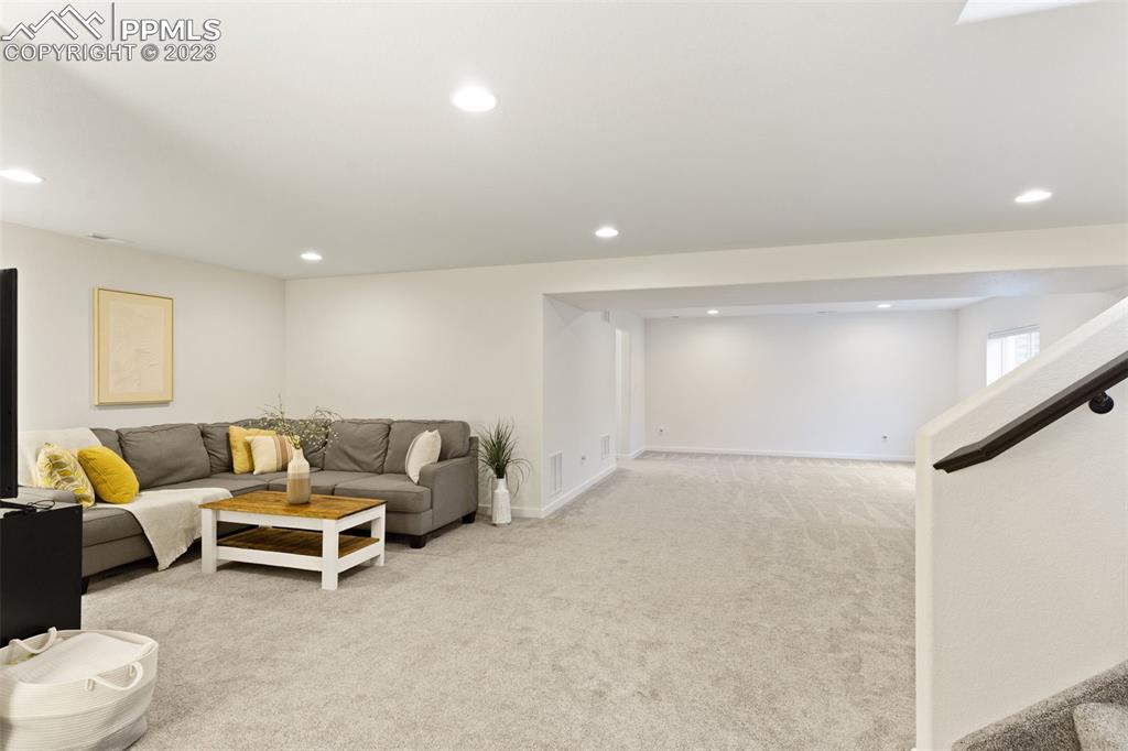 11969 Alydar Loop Colorado Springs, CO 80921 - Photo 31 of 44 a living room with furniture and a couch