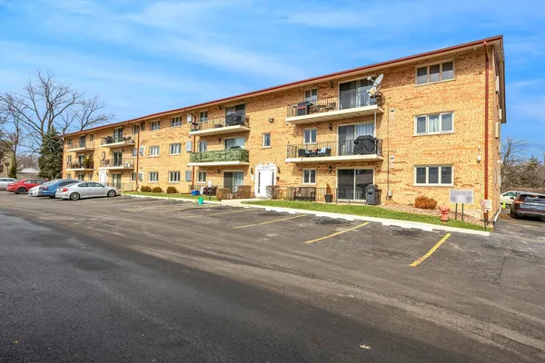 a front view of a building with street view