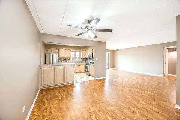 a view of a kitchen with a sink and cabinets