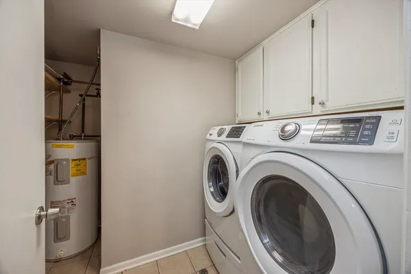 a view of storage and utility room with washer and dryer