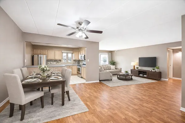 a view of a livingroom with furniture and a flat screen tv