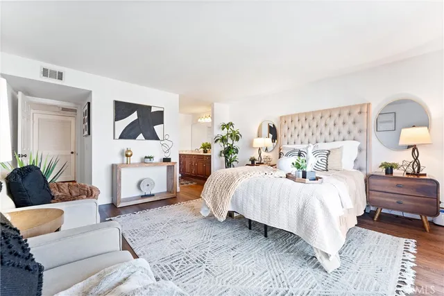 a bedroom with two beds and a couch