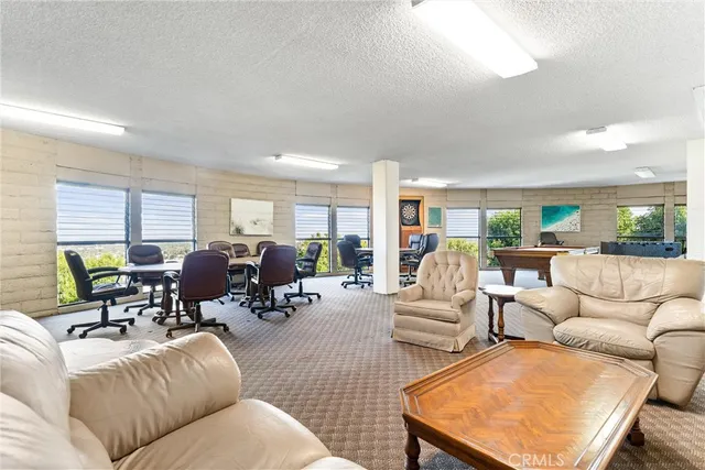 a view of swimming pool with a patio