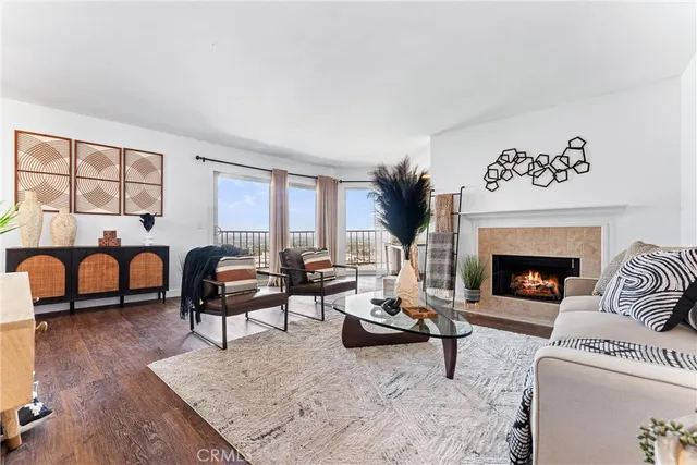 a living room with furniture a rug and a fireplace