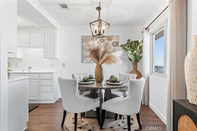 a view of a dining room with furniture and window