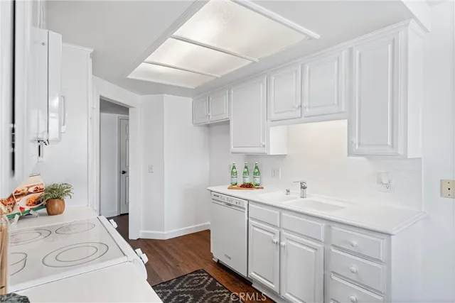 a room with a sink and cabinets