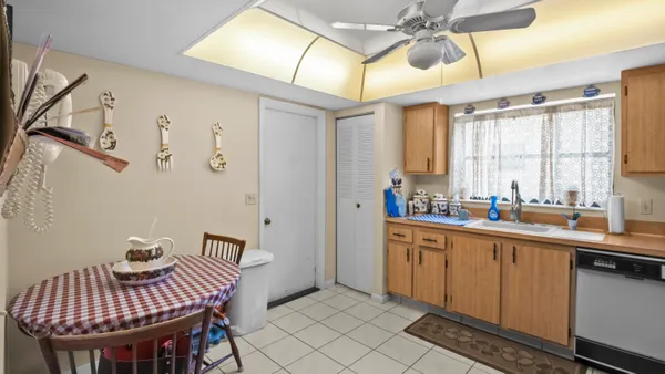 a view of a kitchen filled with furniture and window