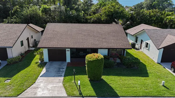 an aerial view of a house having yard