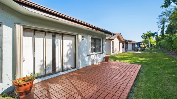 a view of a backyard with a patio