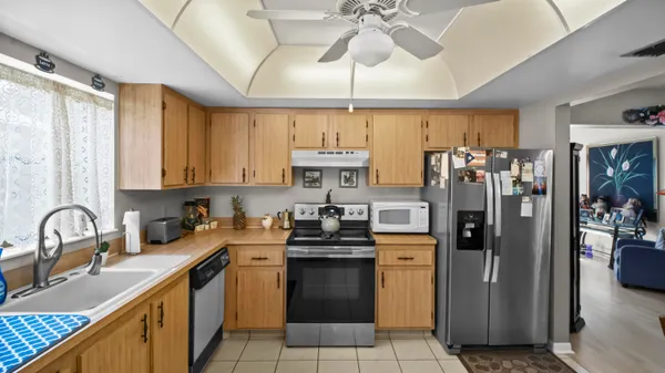 a kitchen with a sink stove and refrigerator