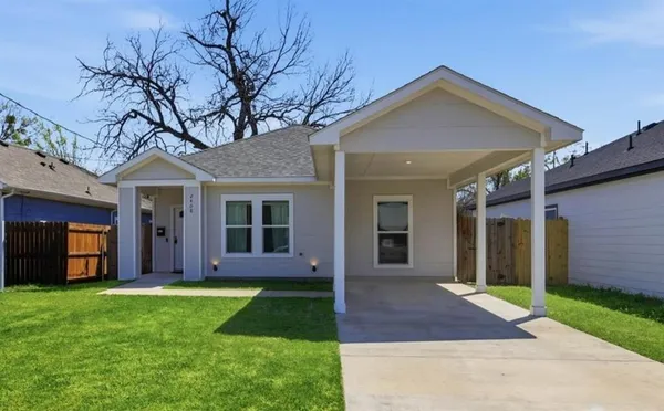 front view of a house with a yard