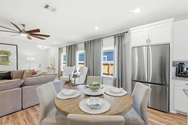 a living room with furniture and a table