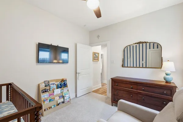 a bedroom with furniture and a window