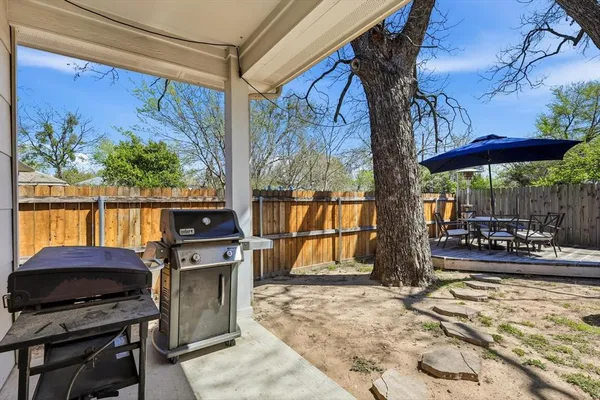 a view of a chairs and table in the patio