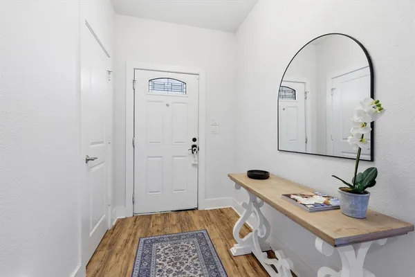 a bedroom with a bed and a table