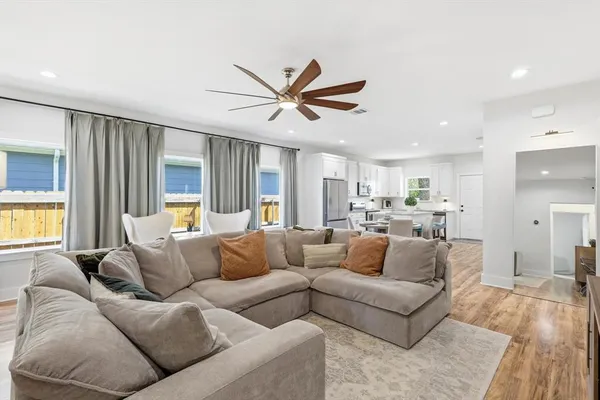 a living room with furniture and a large window