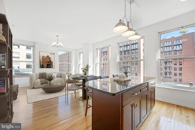 a very nice looking living room with a large window