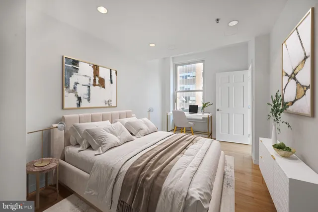 a spacious bedroom with a large bed and a couch