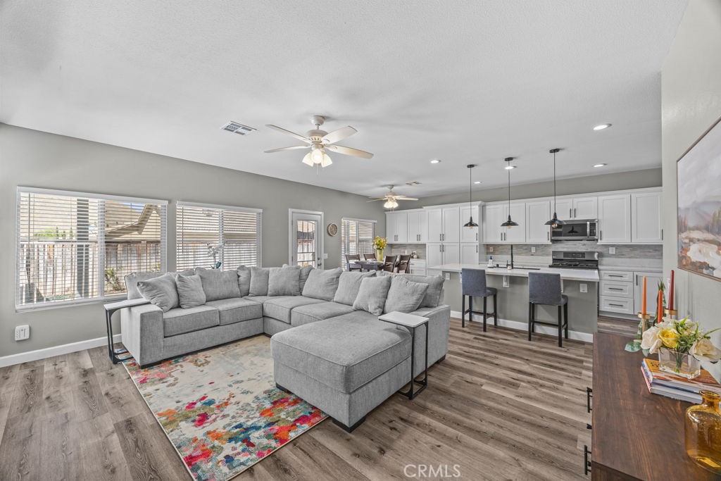 1251 Stepstone Court Hemet, CA 92545 - Photo 12 of 51 a living room with furniture and view of kitchen