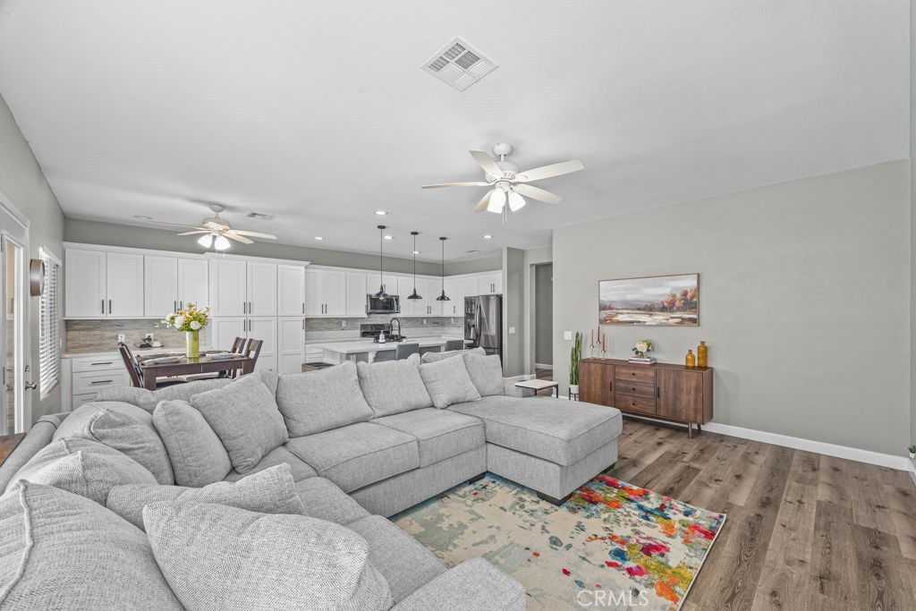 1251 Stepstone Court Hemet, CA 92545 - Photo 14 of 51 a living room with furniture and a wooden floor