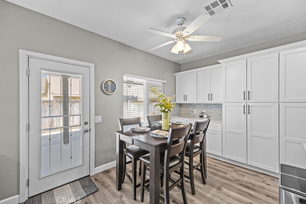 1251 Stepstone Court Hemet, CA 92545 - Photo 15 of 51 a view of a dining room with furniture and chandelier