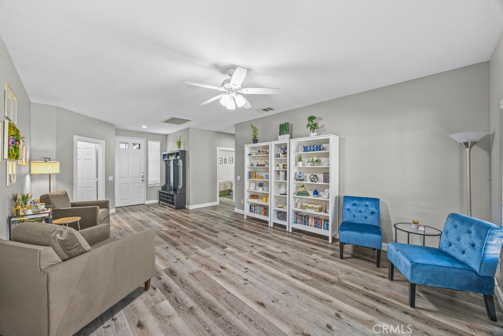1251 Stepstone Court Hemet, CA 92545 - Photo 18 of 51 a living room with furniture and a wooden floor