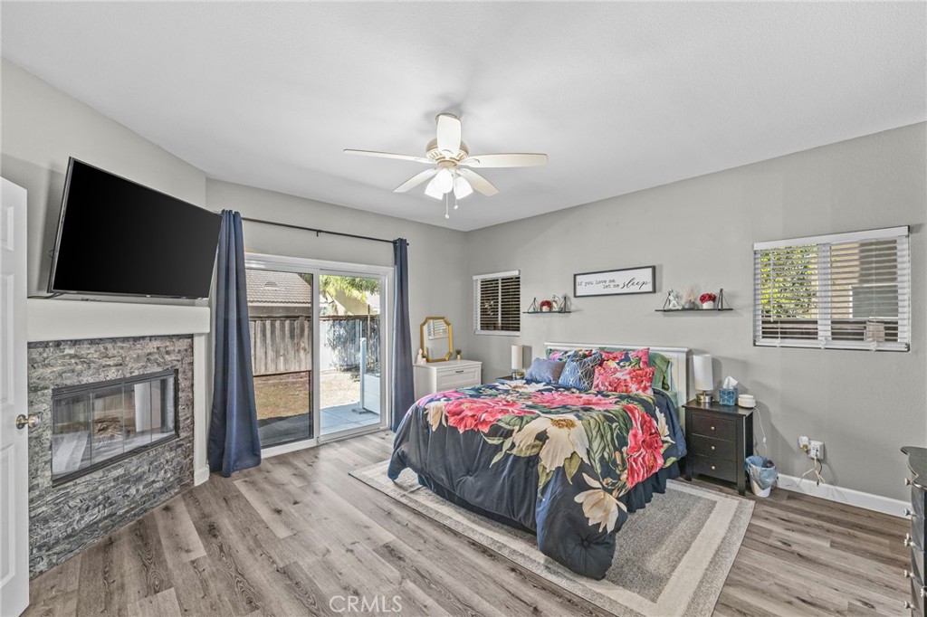 1251 Stepstone Court Hemet, CA 92545 - Photo 22 of 51 a bedroom with a bed and a flat screen tv