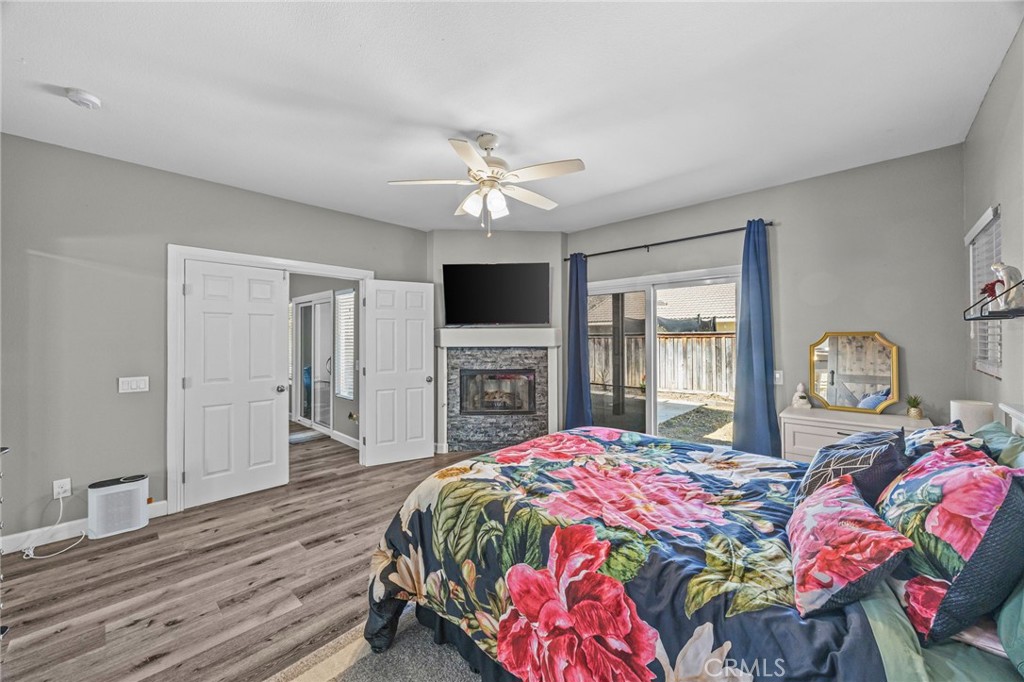 1251 Stepstone Court Hemet, CA 92545 - Photo 23 of 51 a bedroom with a bed dresser and a flat screen tv