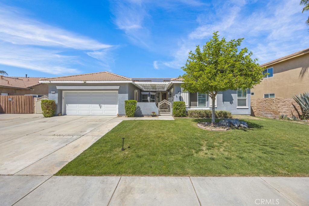1251 Stepstone Court Hemet, CA 92545 - Photo 3 of 51 a front view of a house with garden