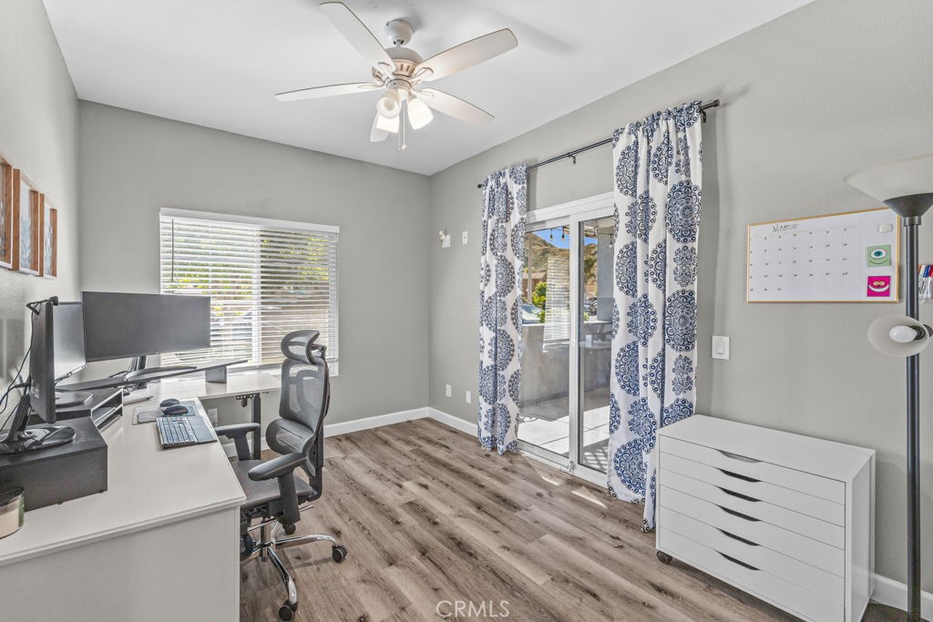 1251 Stepstone Court Hemet, CA 92545 - Photo 31 of 51 a view of a workspace with furniture and a window