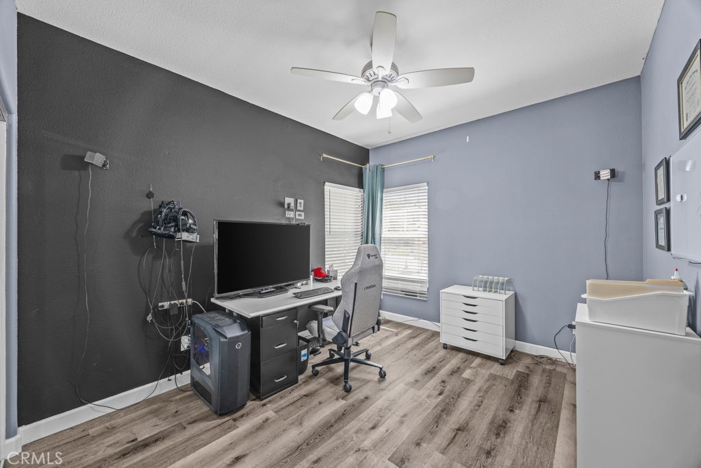 1251 Stepstone Court Hemet, CA 92545 - Photo 32 of 51 a workspace with furniture and chandelier