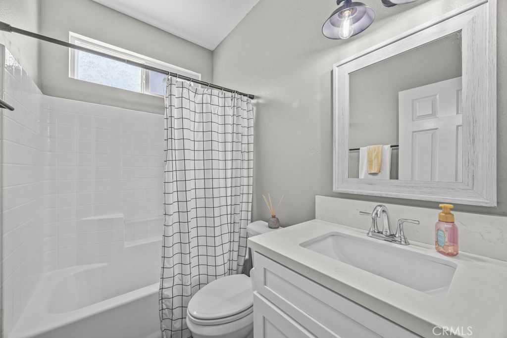 1251 Stepstone Court Hemet, CA 92545 - Photo 35 of 51 a bathroom with a sink a toilet and shower