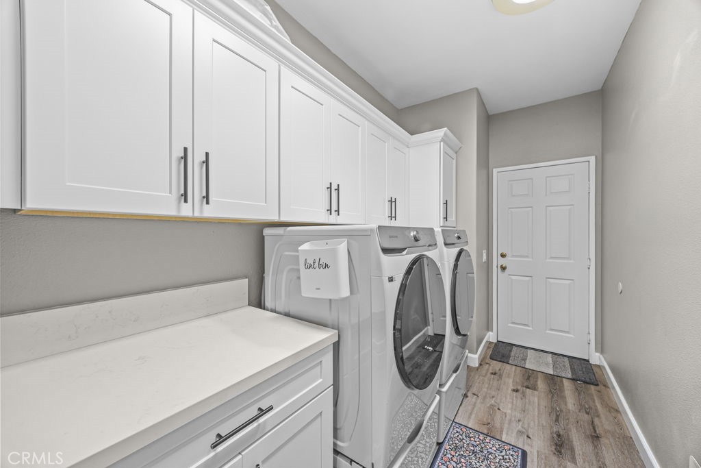 1251 Stepstone Court Hemet, CA 92545 - Photo 36 of 51 a utility room with sink dryer and washer