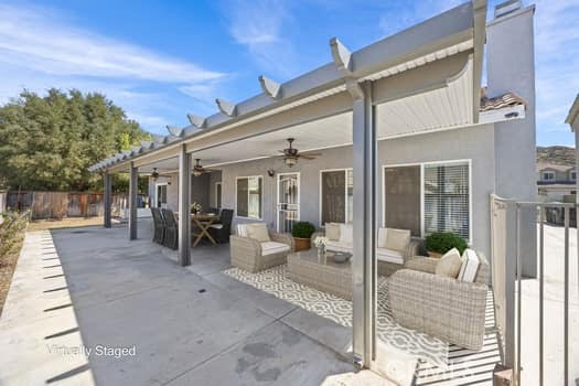 1251 Stepstone Court Hemet, CA 92545 - Photo 37 of 51 a view of a patio with table and chairs and potted plants