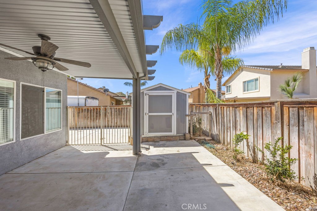 1251 Stepstone Court Hemet, CA 92545 - Photo 40 of 51 a view of a house with a floor to ceiling window and potted plants