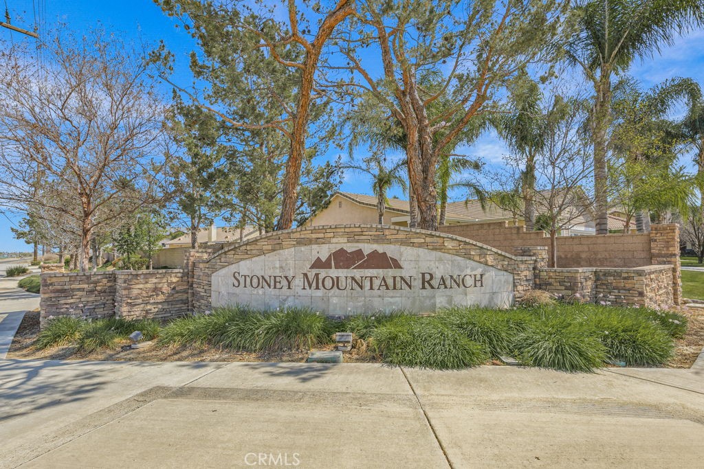 1251 Stepstone Court Hemet, CA 92545 - Photo 47 of 51 a front of a brick building with large tree