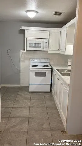 a bathroom with a toilet sink and bathtub