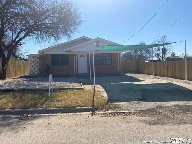 a swimming pool with some potted plants