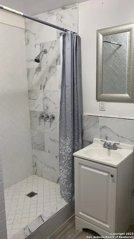 a white toilet sitting next to a bathroom sink