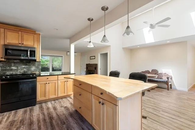 a kitchen with a stove a sink and a refrigerator