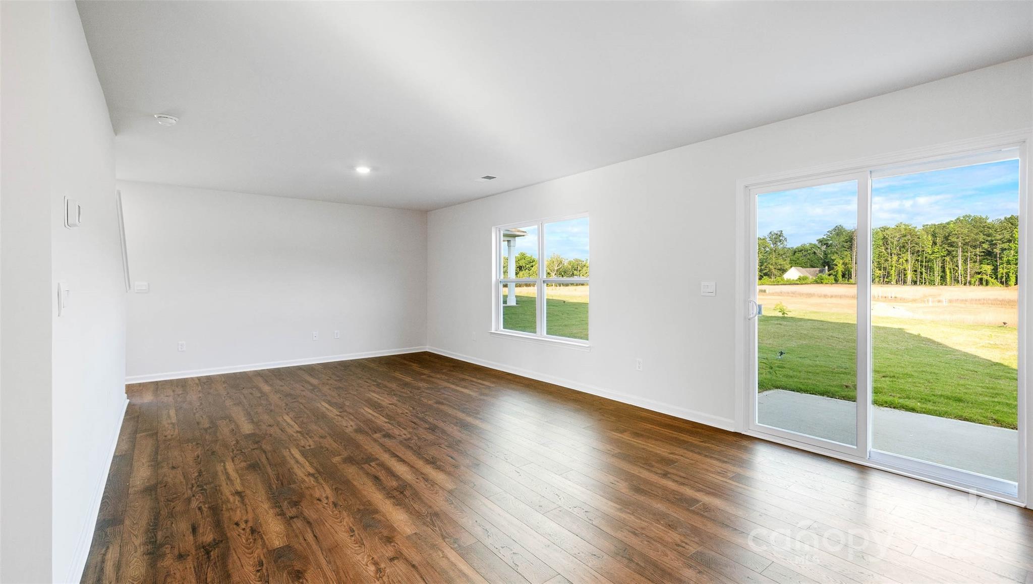 22 Callie River Clyde, NC 28721 - Photo 15 of 23 a view of an empty room with wooden floor and a window