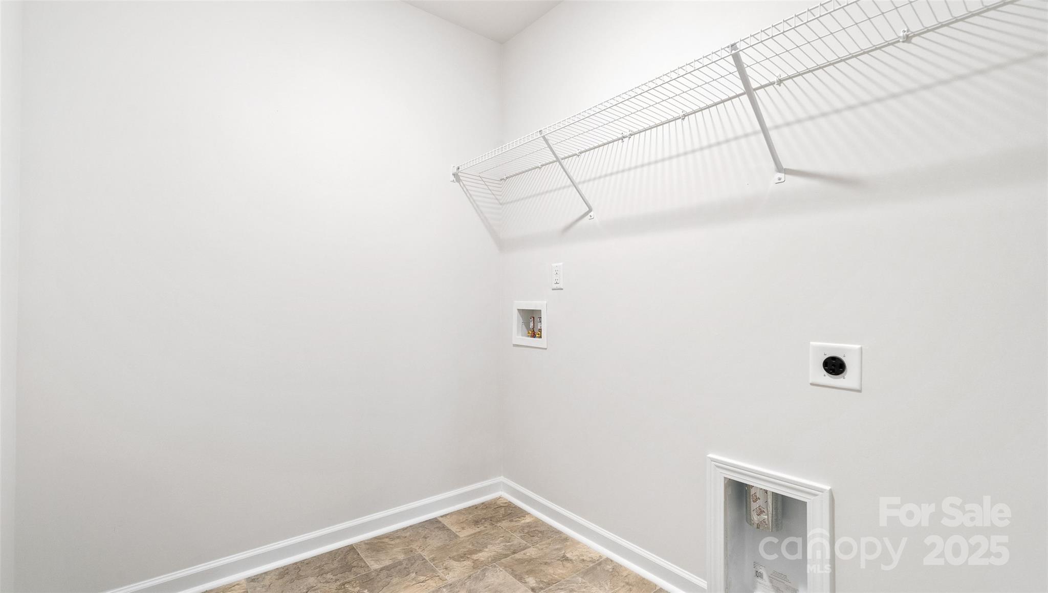 22 Callie River Clyde, NC 28721 - Photo 19 of 23 a view of a room with racks on the wall