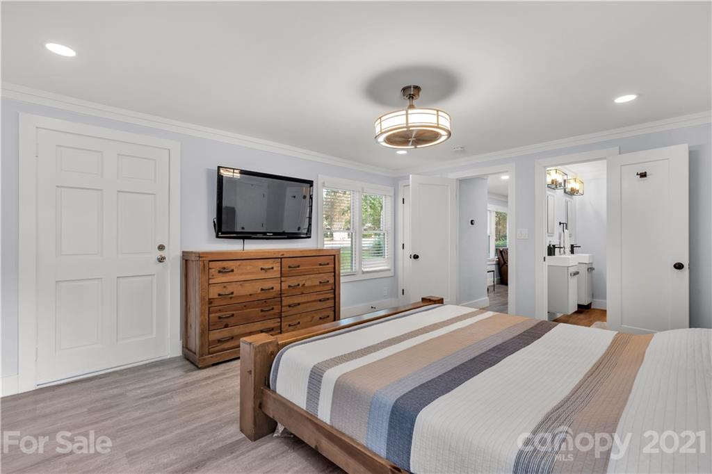 2616 Williams Road Matthews, NC 28105 - Photo 17 of 26 a bedroom with a bed and wooden floor