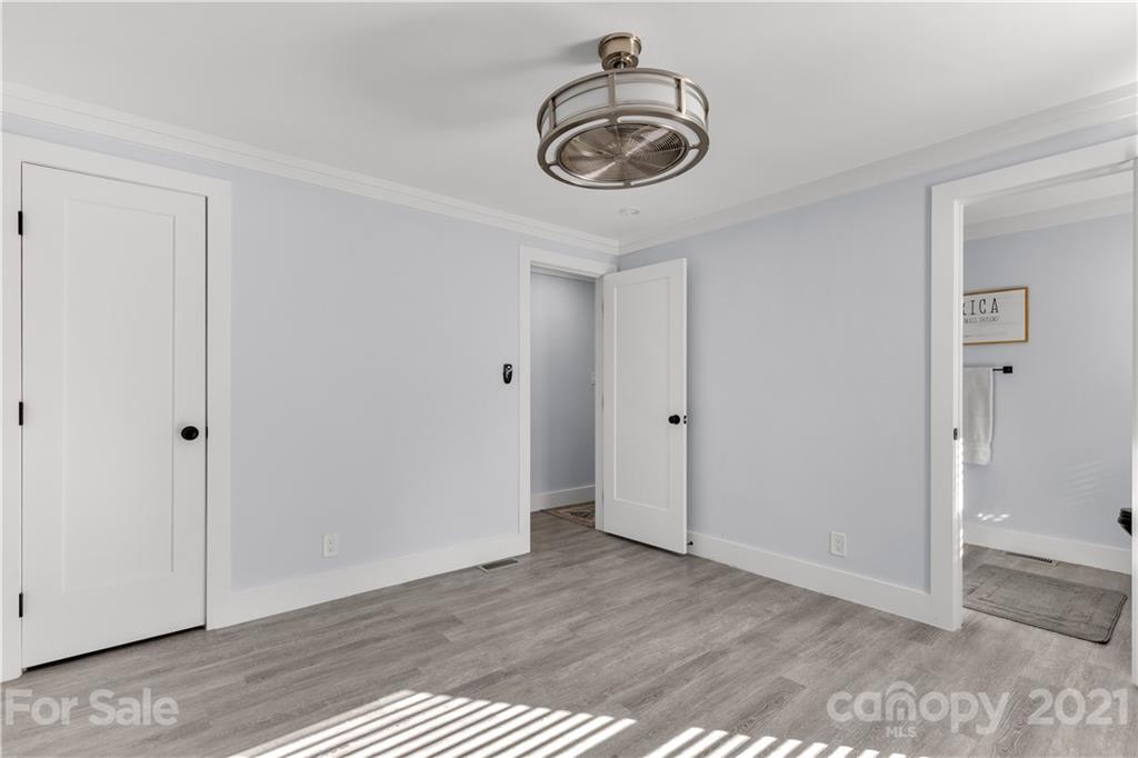 2616 Williams Road Matthews, NC 28105 - Photo 22 of 26 a view of empty room with wooden floor and ceiling fan