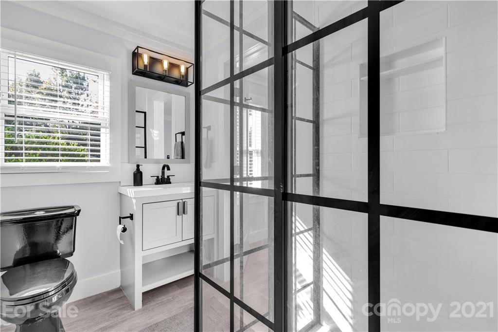 2616 Williams Road Matthews, NC 28105 - Photo 23 of 26 a bathroom with a toilet a sink and a window