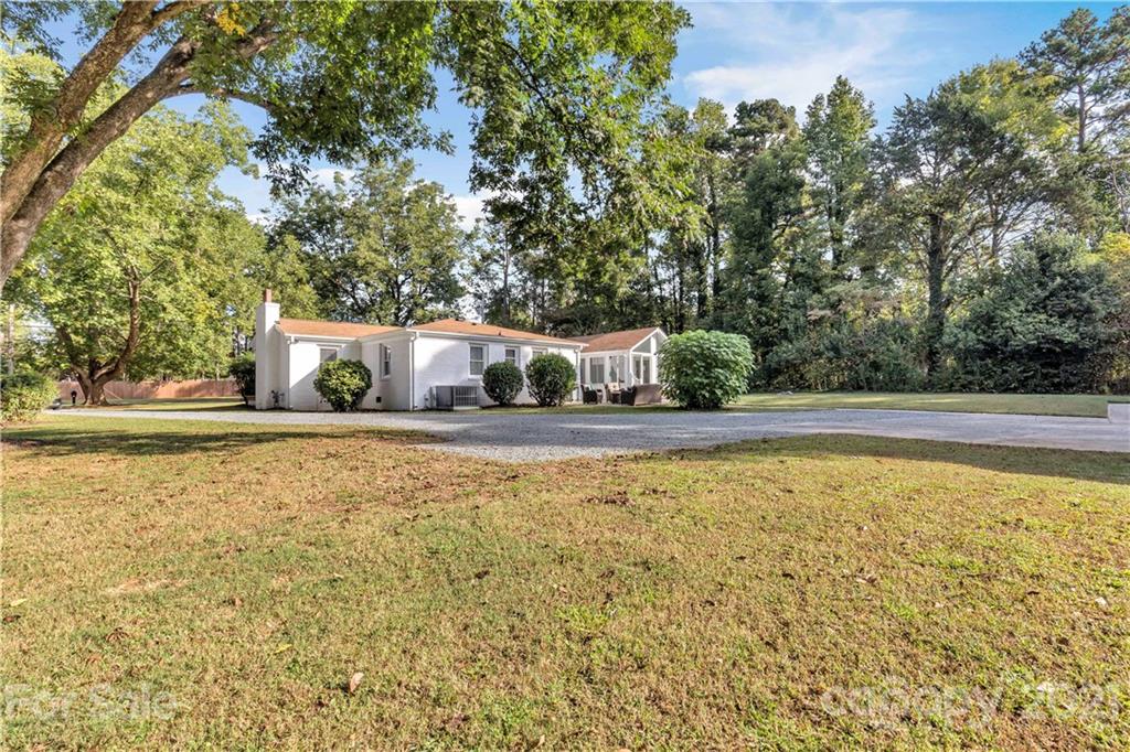 2616 Williams Road Matthews, NC 28105 - Photo 4 of 26 a view of a house with a yard