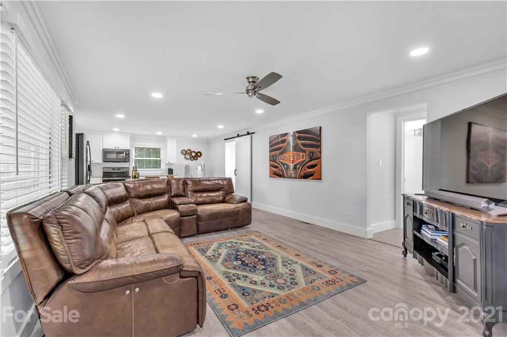 2616 Williams Road Matthews, NC 28105 - Photo 8 of 26 a living room with furniture and a flat screen tv