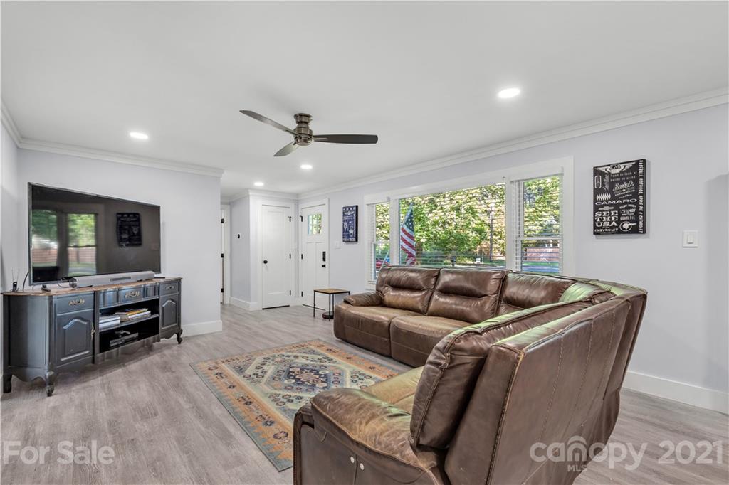 2616 Williams Road Matthews, NC 28105 - Photo 9 of 26 a living room with furniture and a flat screen tv