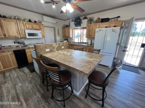 a kitchen with stainless steel appliances granite countertop a stove and a sink
